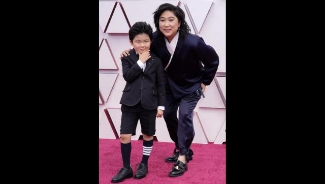 Alan S Kim, left, and Vicky Kim arrive at the Oscars. (AP Photo/Chris Pizzello, Pool)