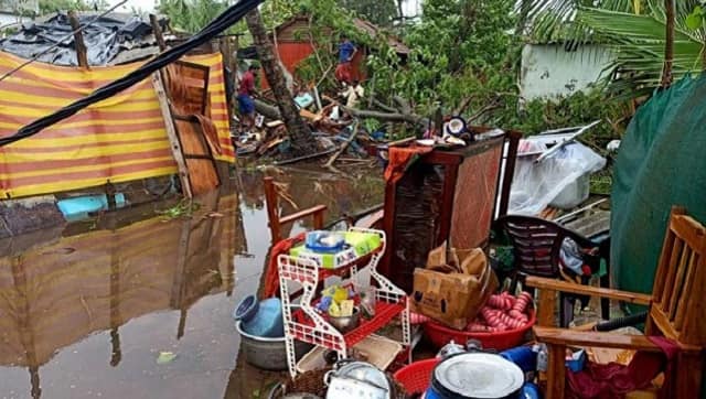 Locals keep their things on an elevated platform due to waterlogging in Alappuzha. PTI