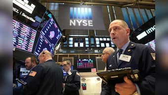 Health, defense stocks help Wall St. grind higher