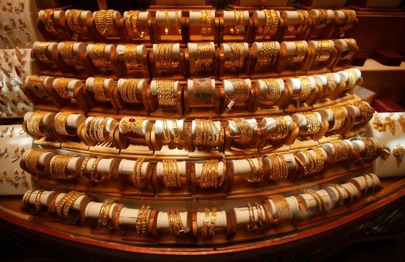 Gold hits eightmonth peak on USChina trade woes focus on Fed