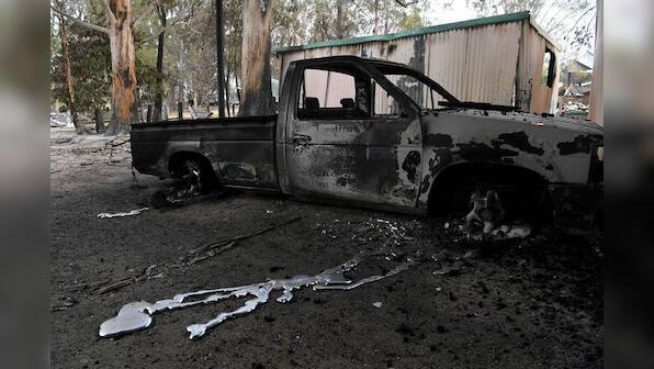Australian bushfires claim third victim as more than 100 blazes burn