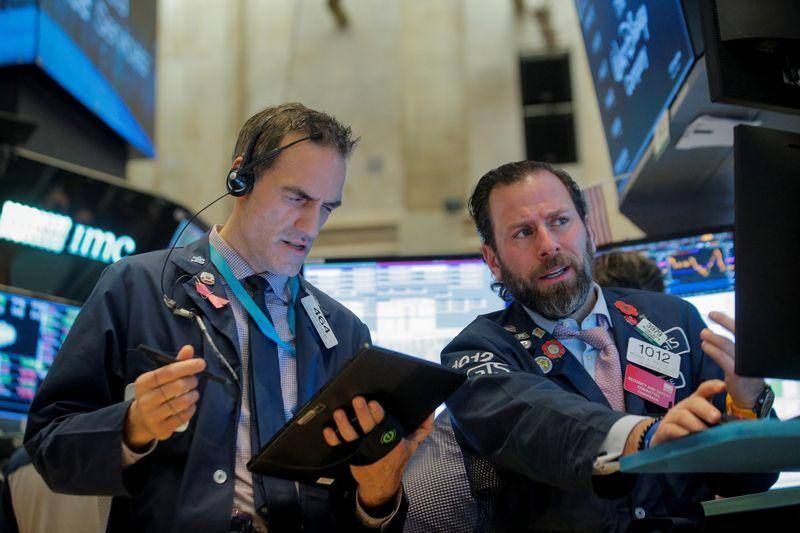 Wall St. notches records on trade optimism, Apple gains