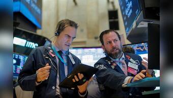 Wall St. notches records on trade optimism, Apple gains