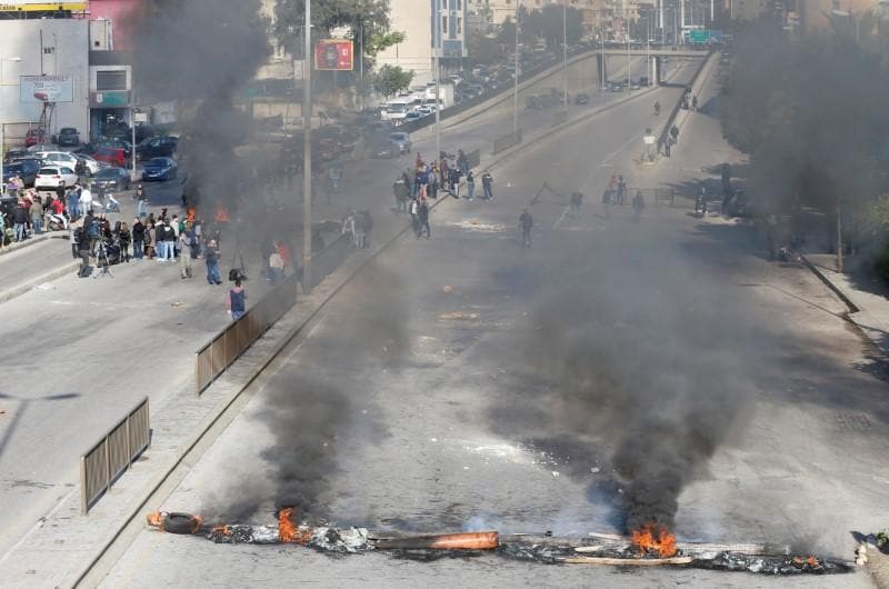 Lebanon security forces fire tear gas clash with protesters near central bank