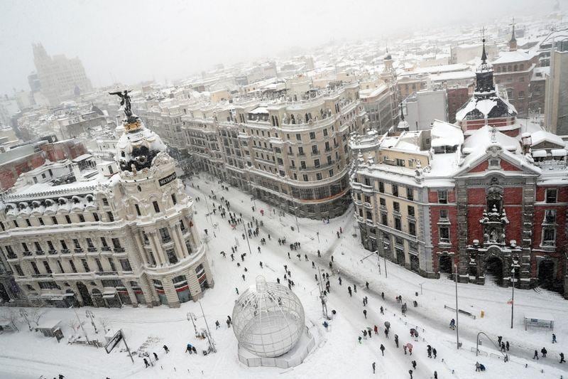 Spaniards ski through Madrid as snow storm kills four