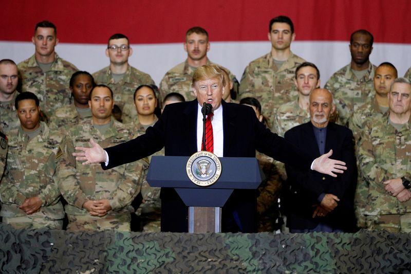 Exclusive Pentagon presses ahead with Afghanistan troop drawdown despite law barring it