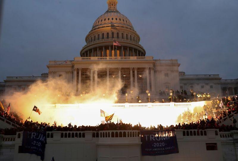Man suspected of throwing fire extinguisher at police in US Capitol is arrested