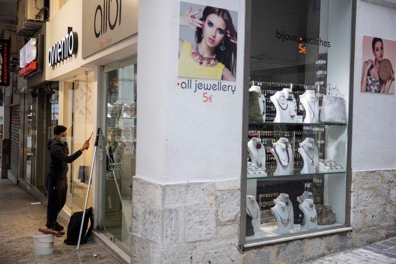 Joy and caution as Greek shops reopen amid strict safety limits