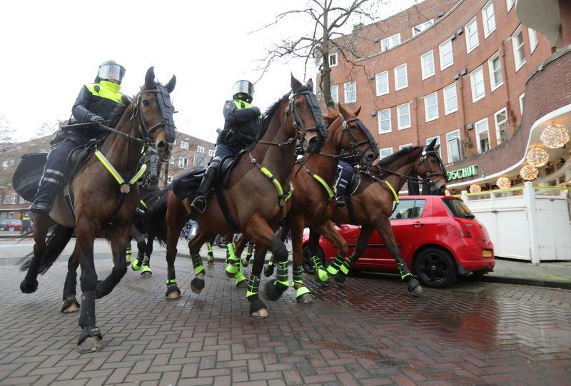 Dutch police detain 240 nationwide as antilockdown protests turn violent
