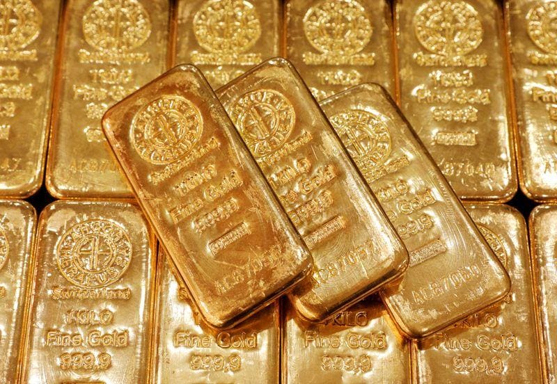 Gold hits more than oneweek low on doubts over stimulus bill firm dollar