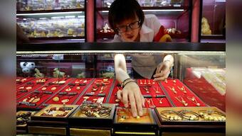 Gold surges to seven-year peak as pandemic fears spark safe-haven rush