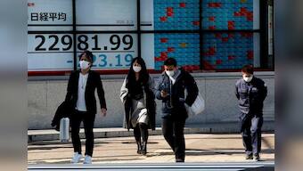 Japan shares dive, bond markets bet virus will force rate cuts