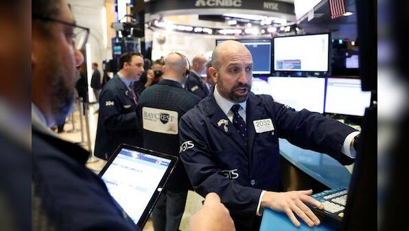 Wall St. falls more slowly as investors parse coronavirus fears