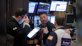 Pandemic fears send investors running as Wall St. confirms correction