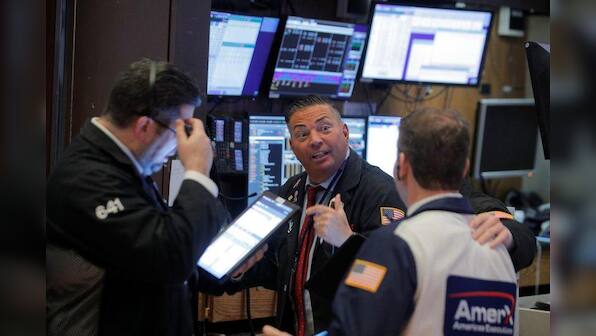 Pandemic fears send investors running as Wall St. confirms correction