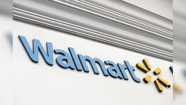 Walmart's investment year will hold back profit growth; shares slide