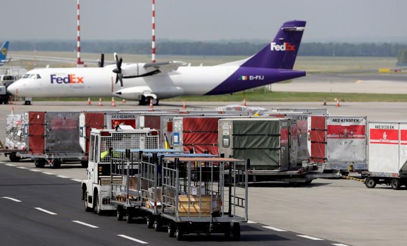 FedEx cuts profit forecast again on economy Express woes