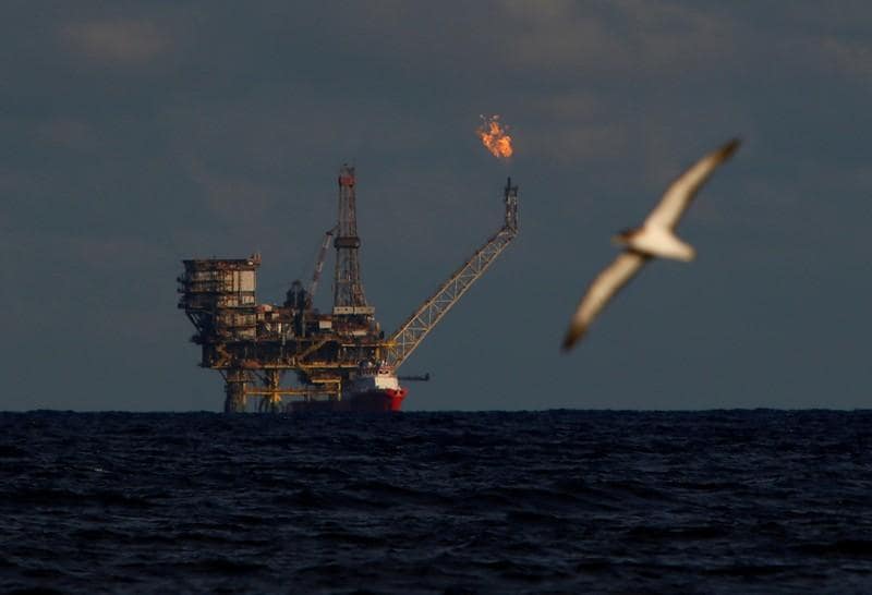 Oil set for best quarterly rise since 2009 on OPEC cuts sanctions