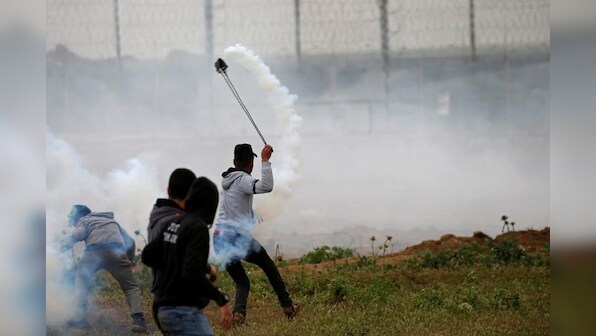 Palestinians mass at Gaza border to mark protest anniversary