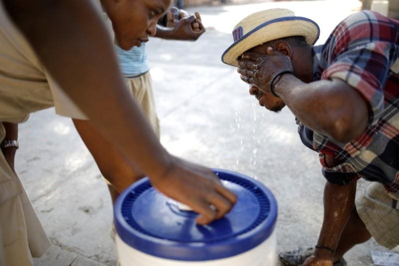 Haitis Scouts set up mobile hand washing sinks to ward off coronavirus