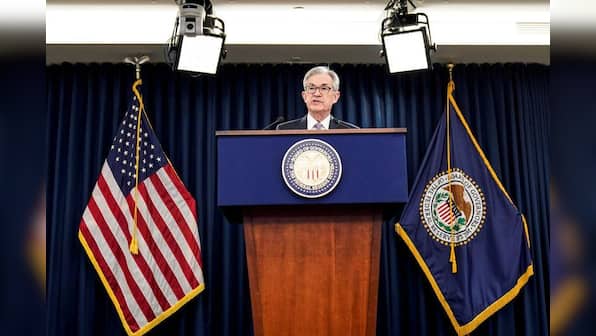Fed sees higher growth, above target inflation this year, rates remain steady