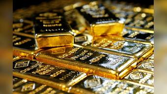 Gold up near two-week high as ECB, Fed give dovish signals