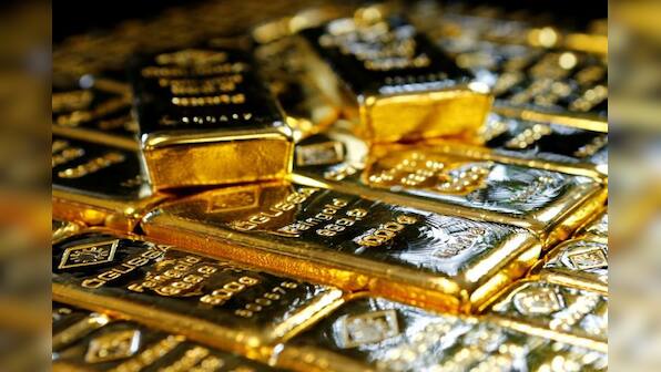 Gold up near two-week high as ECB, Fed give dovish signals