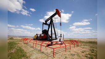 Oil prices dip on surging U.S. crude stockpiles