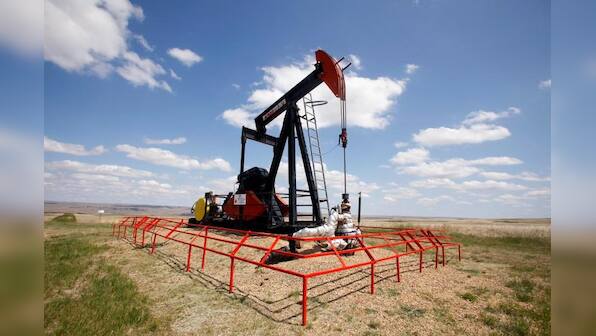 Oil prices dip on surging U.S. crude stockpiles