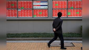 Stocks slide before corporate results, dollar gains