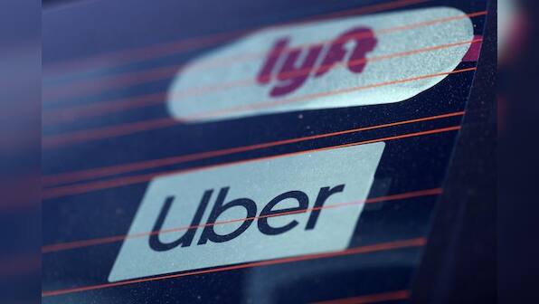 Factbox: How Uber and Lyft compare on key financial metrics