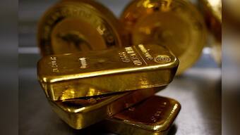 Gold prices inch lower as strong equities weigh