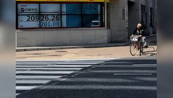 Asia stocks hover below nine-month peak after Wall Street stalls