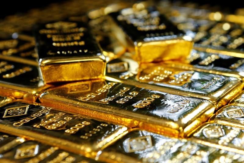 Gold slips to fourmonth low on stronger dollar stocks