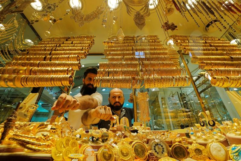 Gold scales oneweek peak as equities and dollar ease
