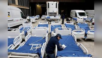 U.S. rushes to build makeshift hospitals as death toll rises over 800