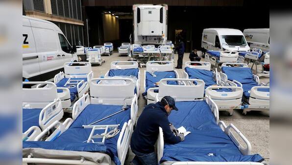 U.S. rushes to build makeshift hospitals as death toll rises over 800