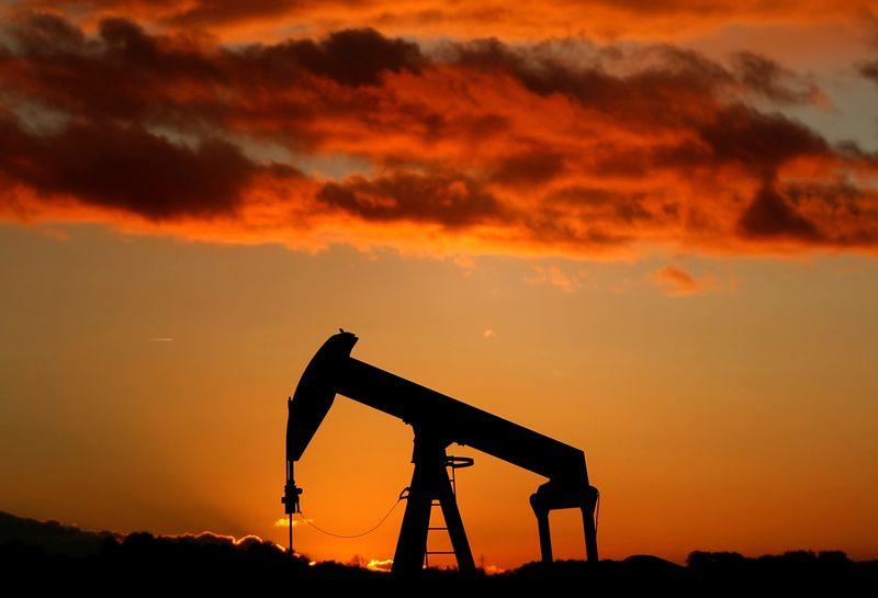 Oil flat as weaker dollar offsets surge in US gasoline stocks