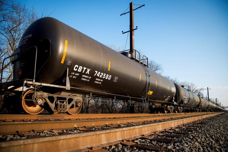 Oil firms on Iran sanction worries, but surging U.S. supplies cap market