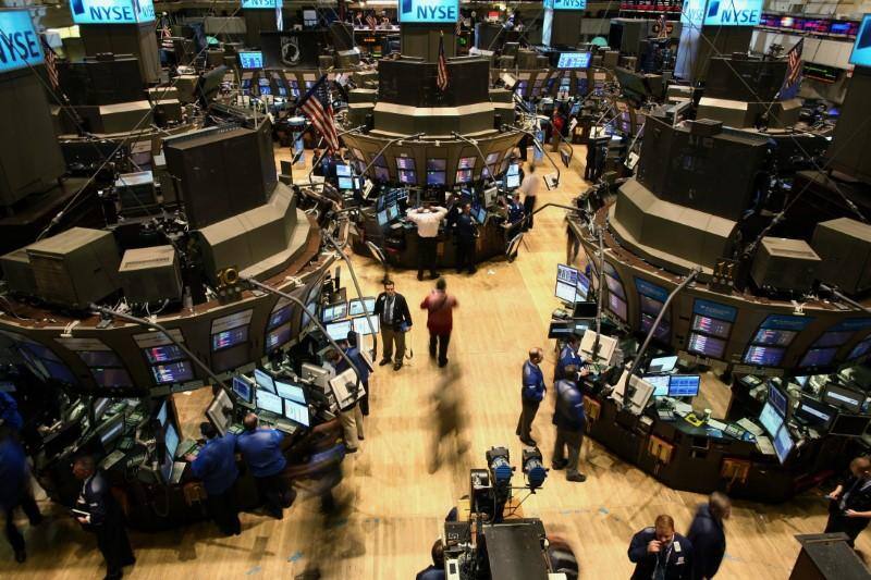 Markets Right Now: Stocks are mixed at midday; Apple surges