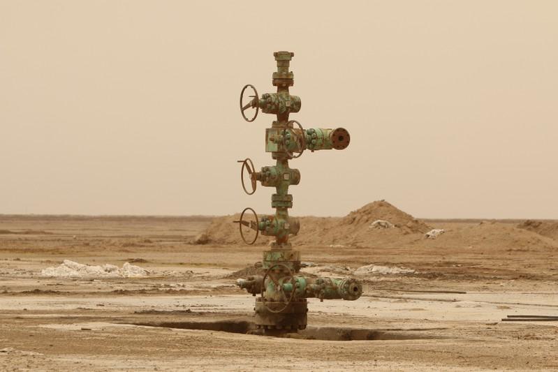 Oil prices fall on rising U.S. crude inventories, record production