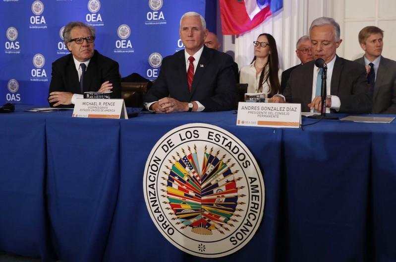 U.S. sanctions three Venezuelans, Pence calls for more action