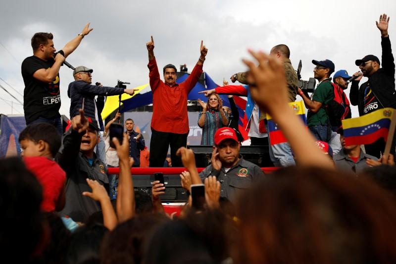Rival Venezuela opposition candidates vow to stay in race, splitting vote