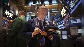 Wall St. ends down slightly on trade, oil price concerns