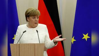 Putin seeks common cause with Merkel over Trump