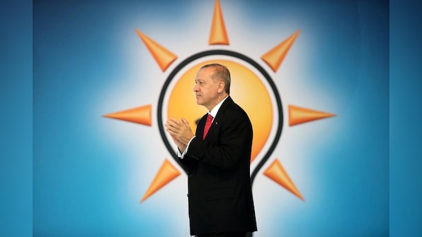 As lira tumbled, Turkey's prime minister won Erdogan over for rate hike