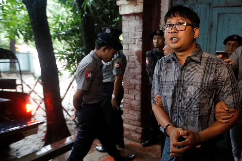 Myanmar police witness says searched Reuters reporters phones without warrant