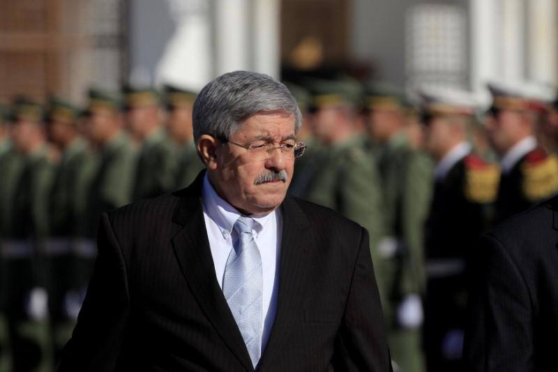 Algeria’s ruling party relatively young new leader amid protests
