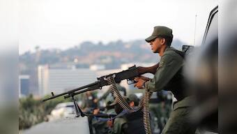 Venezuela's Guaido urges troops to unite against Maduro, violence erupts