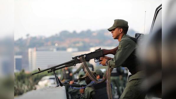 Venezuela's Guaido urges troops to unite against Maduro, violence erupts